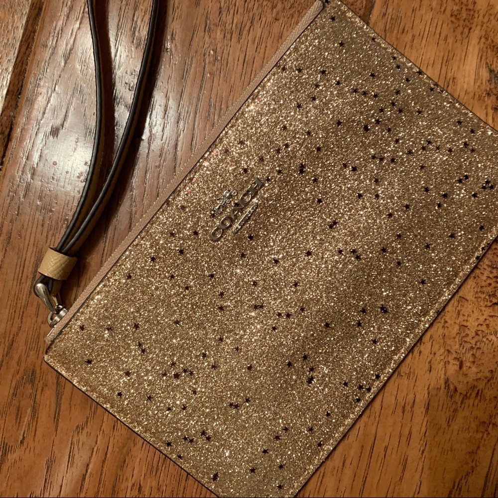 Coach Gold with burgundy stars wristlet
